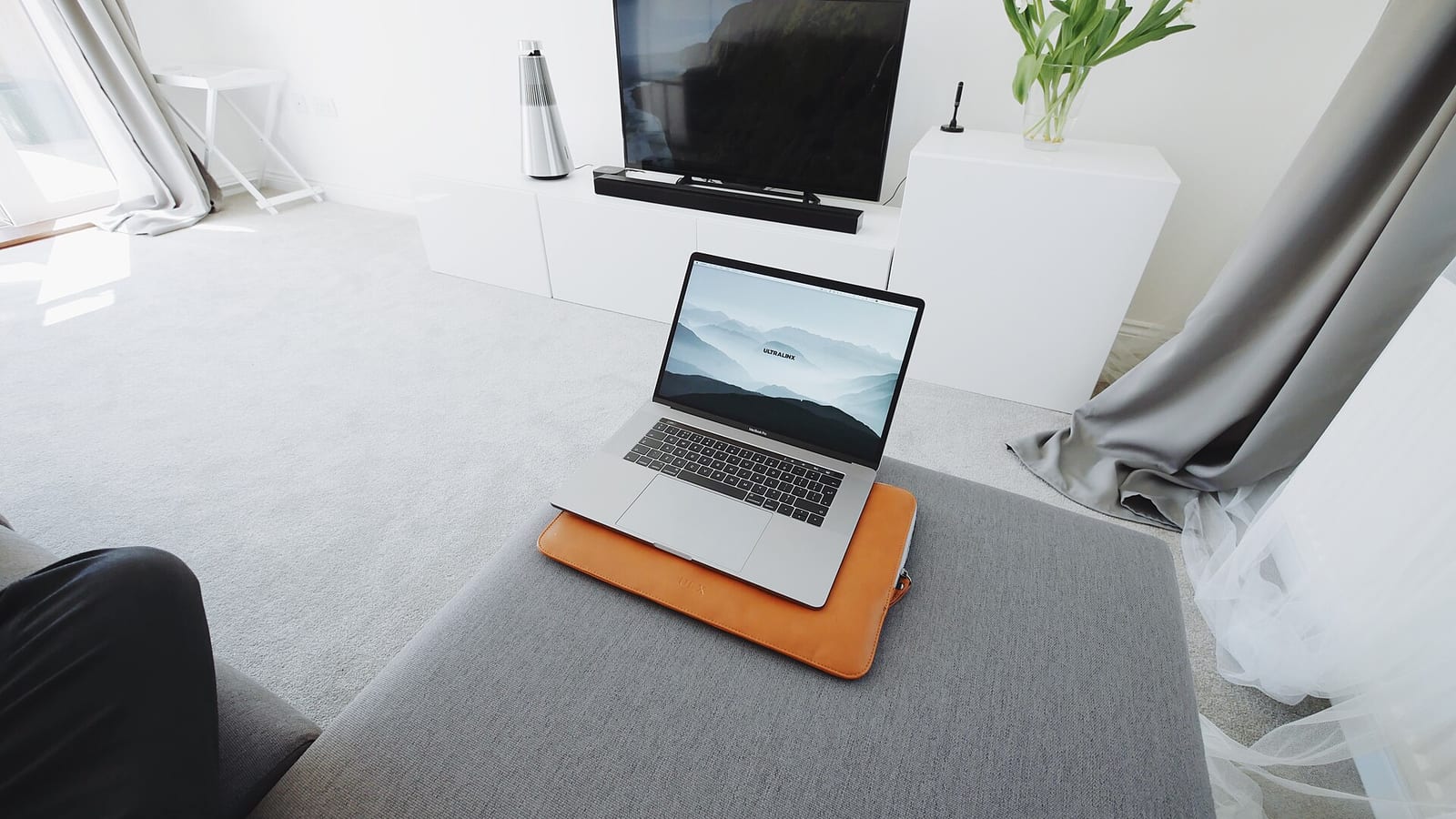 A laptop in a living room.