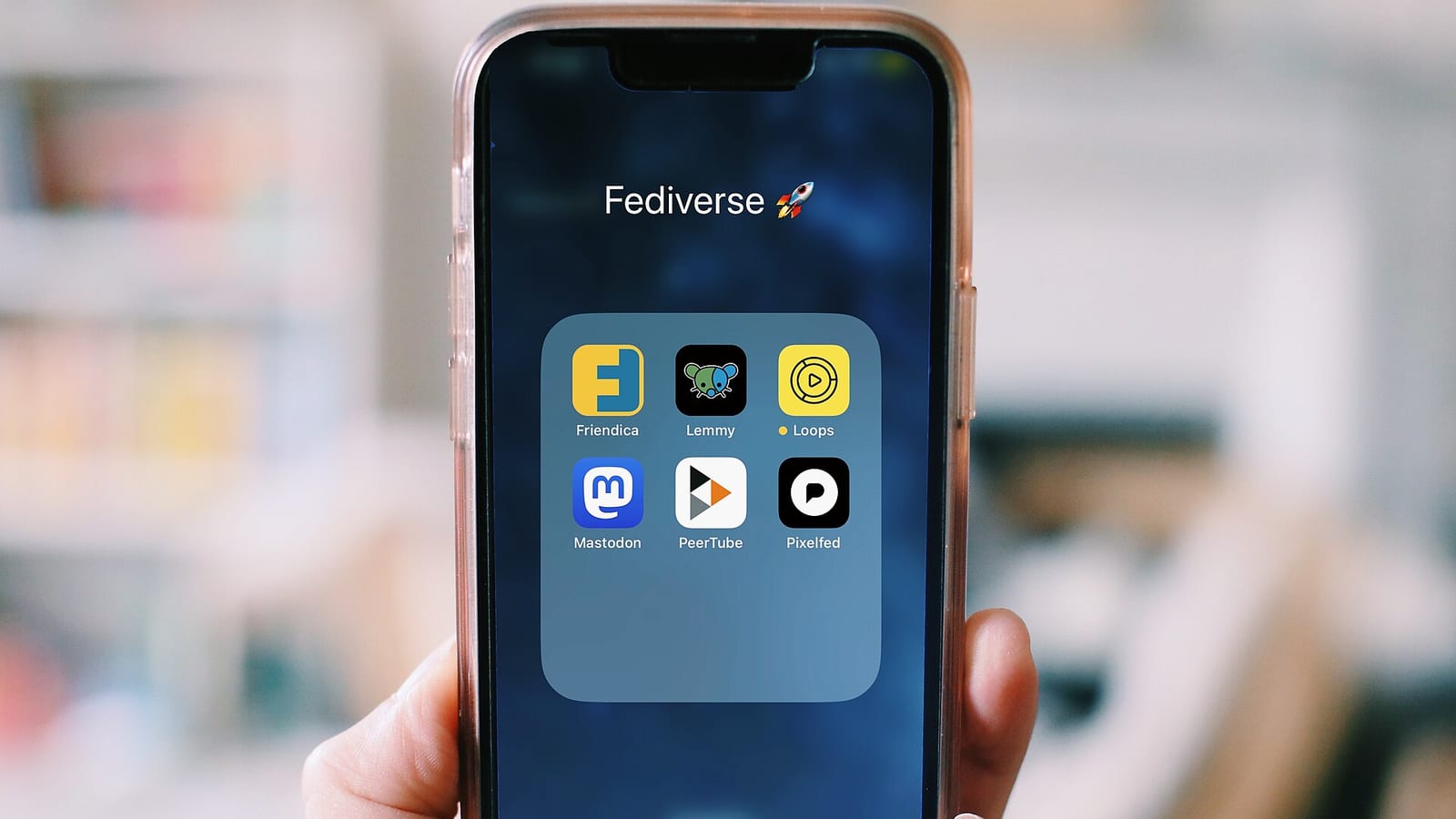 Social-media apps displayed on a smartphone.