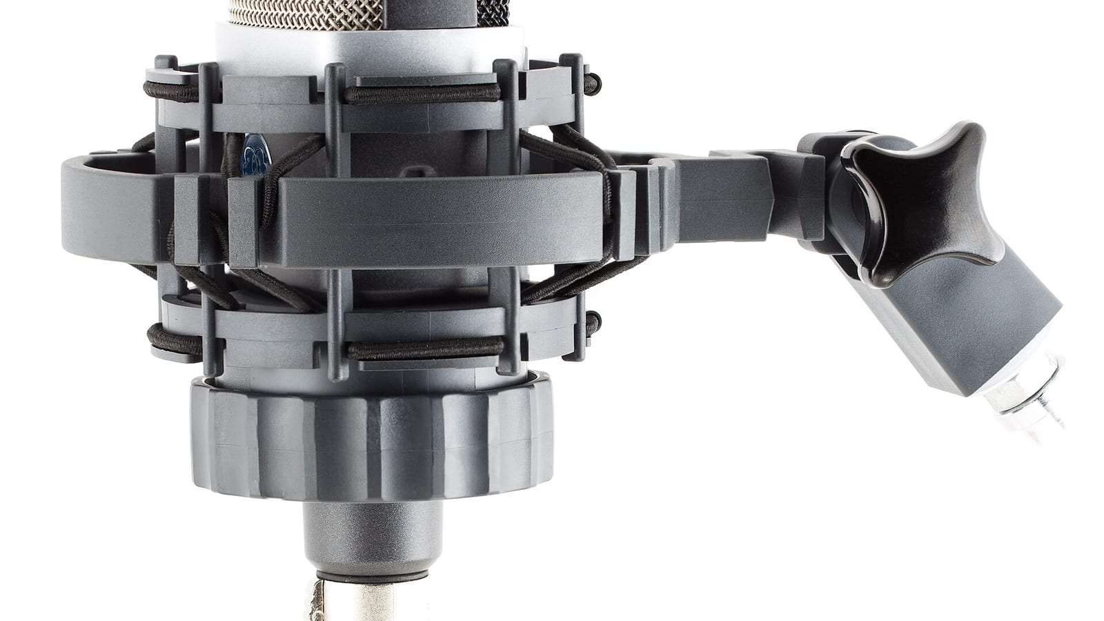 An AKG C214 condenser microphone with a shock mount.